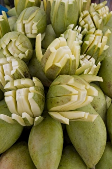 Selling Prints: Sliced raw mangoes displayed for sale, Kanyakumari, Tamil Nadu, India, Asia
