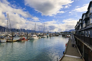 Fishing Industry Prints: Small Boat Harbour, hotel, small boats and mountains