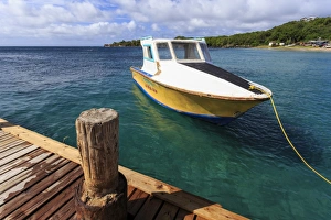 Windward Islands Prints: Small boat and jetty, Saline Bay