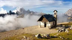 Small church with the Cadini di Misurina mountain range in the background, Dolomites