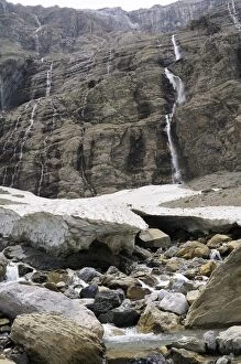 Small glacier and source of the Gave River at foot of waterfalls at the Cirque de Gavarnie, Pyrenees National Park