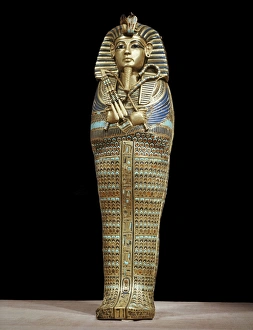 One of the four small gold mummiform coffins placed in the canopic urns