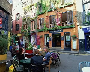 Covent Garden Collection: Small group of people sitting outdoors at tables of a cafe in Neals Yard