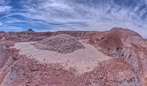 Wide Shot Prints: A small hill of gray bentonite clay that appears to be melting into the purple bentonite of Hamilili Valley