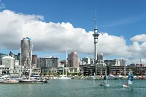 North Island Prints: Small sailboats cruise in Auckland harbour in front of the city skyline, Auckland