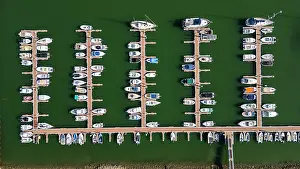 Docked Prints: Small ship harbour in Algarve shows numerous boats arranged neatly along docks in Olhao
