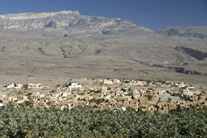 Images Dated 11th February 2008: Small town beside its irrigated palmery, Al Hamra, at foot of mountain of Jabal Akhdar