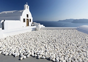 Greek Orthodox Prints: Small whitewashed church against blue sea and sky, Finikia, near Oia, Santorini, Cyclades