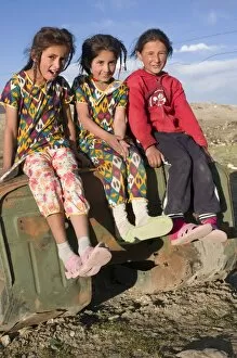 Images Dated 25th August 2009: Three smiling girls posing for the camera, Murgab, Tajikistan, Central Asia, Asia