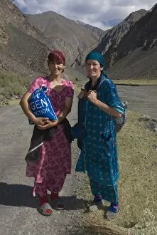 Two smiling women going for a walk in Bartang Valley, Tajikistan, Central Asia, Asia