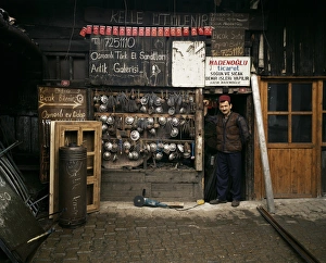 Smith in front of his workshop