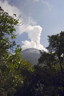 Ecuadorian Prints: Smoke rises from the active crater of Tungurahua Volcano that threatens the nearby resort town of Banos