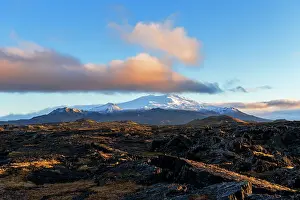 Snaefellsjokull glacier covering the Snaefell volcano seen at sunset with pink clouds and blue sky, Snaefellsnes Peninsula, West Iceland, Iceland, Polar Regions