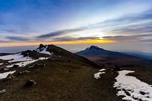 Mountain Pass Prints: Snow capped mountain passes on Mount Kilimanjaro at sunset