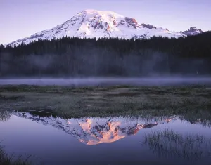 Mirror Prints: Snow capped mountain reflecting in a calm lake at dusk