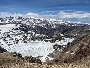 Mountain Pass Prints: Snow-capped mountains and a frozen lake near Beartooth Pass, Wyoming
