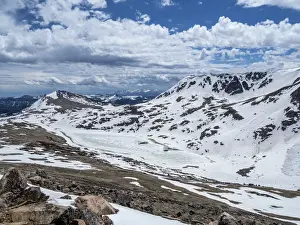 Snow-capped mountains and a frozen lake near Beartooth Pass, Wyoming