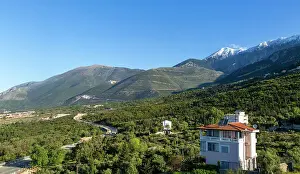 Albania Prints: Snow capped peak of Mount Cika and mountain road over Llogara Pass
