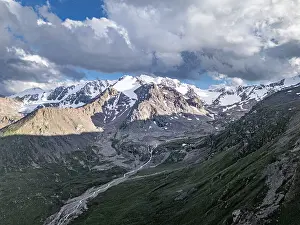 Local Flora Prints: Snow-capped peaks and lush valleys showcased in stunning landscape