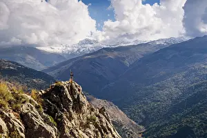 Granada Prints: Snow-capped Sierra Nevada mountains and cross on rock viewed from mountains in Guejar Sierra