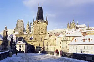 Mala Strana Prints: Snow-covered Gothic Charles bridge with Baroque statues