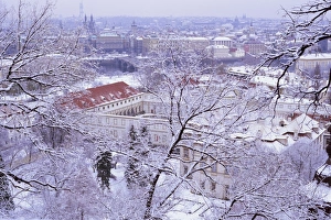 Mala Strana Prints: Snow covered Mala Strana and Stare Mesto rooftops, Prague, Czech Republic, Europe