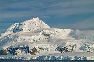 Crystal Prints: Snow-covered mountains rise above the water in Crystal Sound