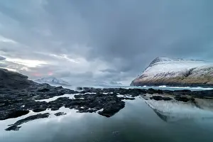 Reflective Prints: Snow covered mountains and rock pool reflections at low tide
