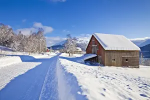 Chalet Prints: Snow covered road, barn and chalets in Norwegian village of Laukslett