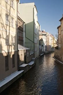 Snow-covered section of Certovka Canal known as Pragues Venice, Mala Strana