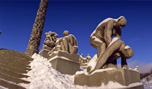 Frogner Park Prints: Snow covered statue in winter