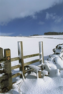Foot Path Prints: Snow covered stile, Hartington, Tissington Trail, Derbyshire, England, United Kingdom