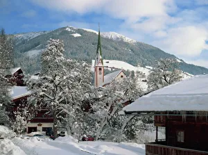 Snow covers the village and church of Alpbach in the Tyrol in the winter, Austria, Europe Snow covers the village and church of Alpbach in the Tyrol in the winter, Austria, Europe