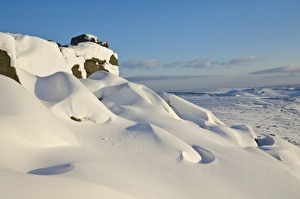 Snow drifts and snow covered moorland at Stanage Edge, Peak District National Park
