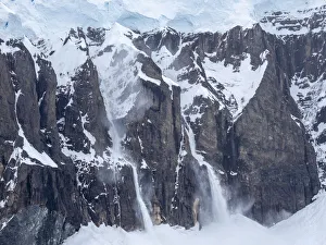 Snow falling in an avalanche on Brabant Island, Antarctica, Polar Regions