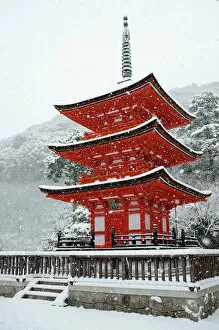 Typically Japanese Gallery: Snow falling on small red pagoda, Kiyomizu-dera Temple, UNESCO World Heritage Site