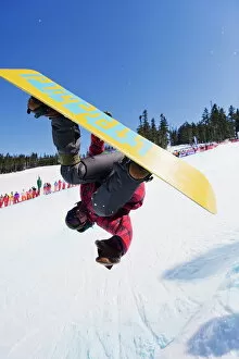 Images Dated 24th April 2009: A snowboarder jumping at Telus Half Pipe competition 2009