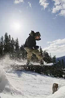 A snowboarder jumping at Whistler mountain resort, venue of the 2010 Winter Olympic Games
