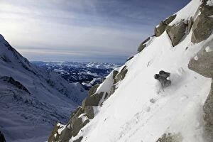 Images Dated 23rd January 2010: A snowboarder tackles a challenging off piste descent on Mont Blanc, Chamonix