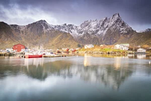 Nordland County Gallery: Snowcapped mountains reflected in the sea at dawn, Ballstad, Vestvagoy, Nordland county