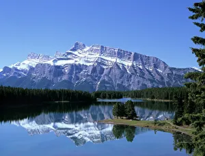 Canadian Prints: Snowy peak of Mount Rundle reflected in the water of Two Jack Lake, Banff National Park