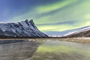 Polar Aurorae Prints: The snowy peak of Otertinden and the Northern Lights (aurora borealis) in the polar night