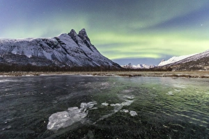 Polar Aurorae Prints: The snowy peak of Otertinden and the Northern Lights in the polar night