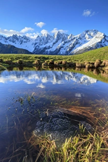 Soglio Prints: Snowy peaks and blue sky reflected in water at dawn, Tombal, Soglio, Bregaglia Valley
