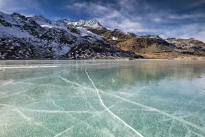 White Lake Prints: The snowy peaks frame the frozen turquoise water of White Lake (Lago Bianco), Bernina Pass