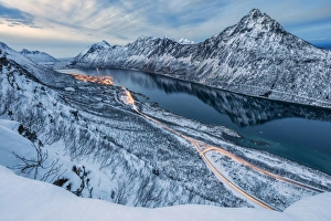 Troms County Prints: The snowy peaks above the frozen sea framed by the blue lights of dusk, Gryllefjorden