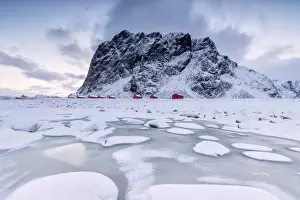 Rorbu Prints: Snowy peaks and ice frame the typical fishermen houses called Rorbu, Eggum, Vestvagoy