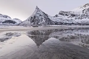 Ersfjord Prints: Snowy peaks reflected in the frozen sea surrounded by sandy beach at dawn, Ersfjord