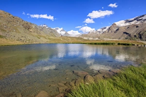 Canton Of Valais Prints: Snowy peaks reflected in Lake Stellisee