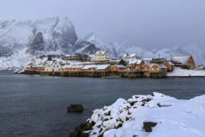 Rorbu Prints: Snowy peaks and rorbu, the red houses of fishermen